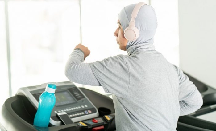 muslim-adult-woman-with-headphones-treadmill_21730-13823.jpg